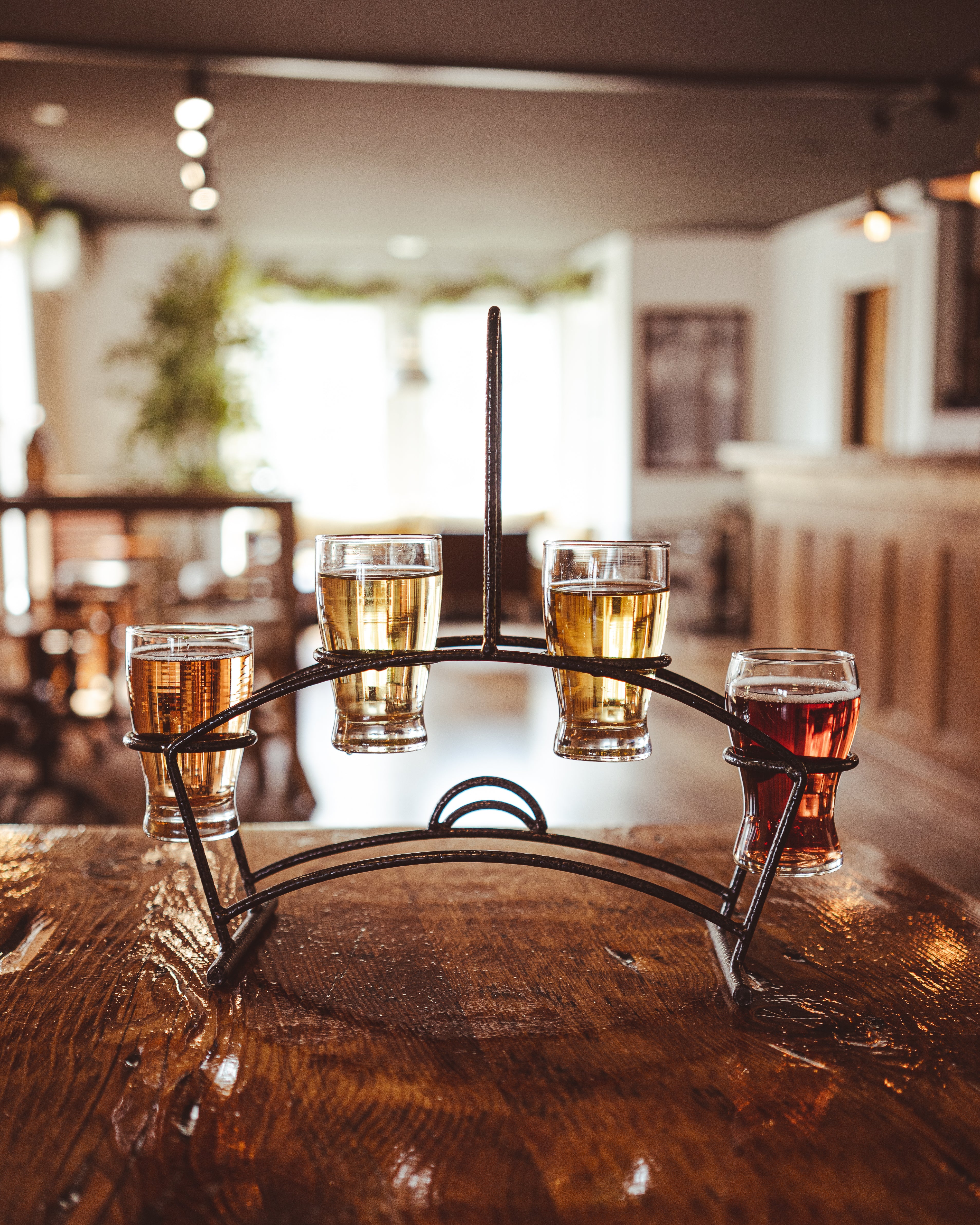 A flight of Cold Hollow Hard Ciders on a table in Cold Hollows Tasting Room